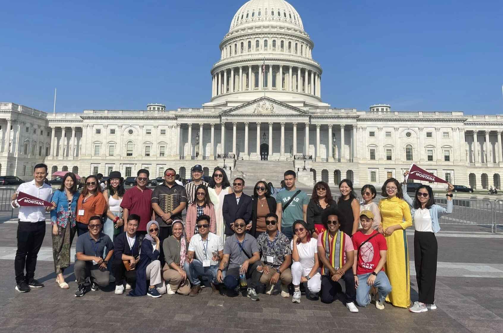 A group of Fellows posing in front of the White House in DC