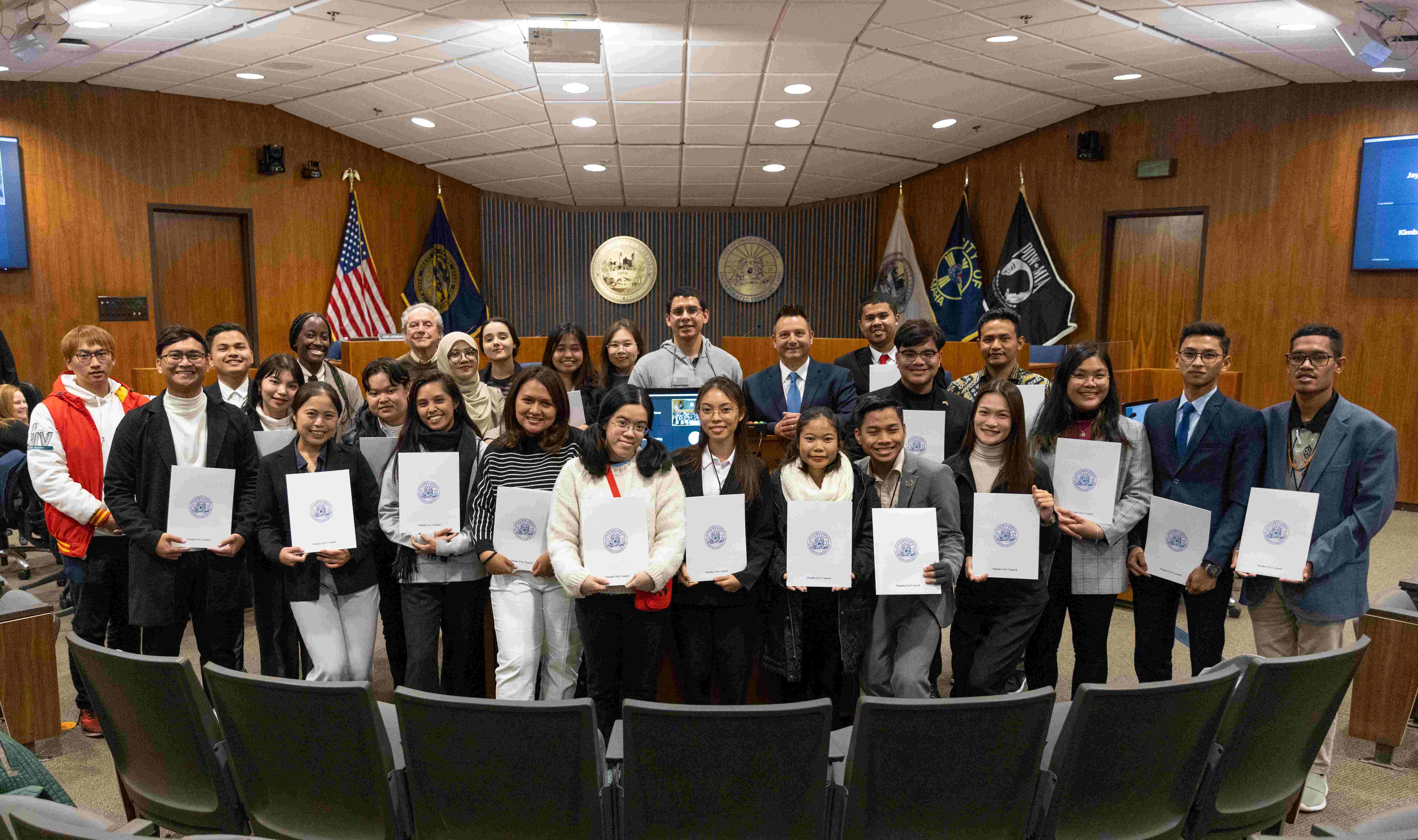 YSEALI members posing with pieces of recognitions