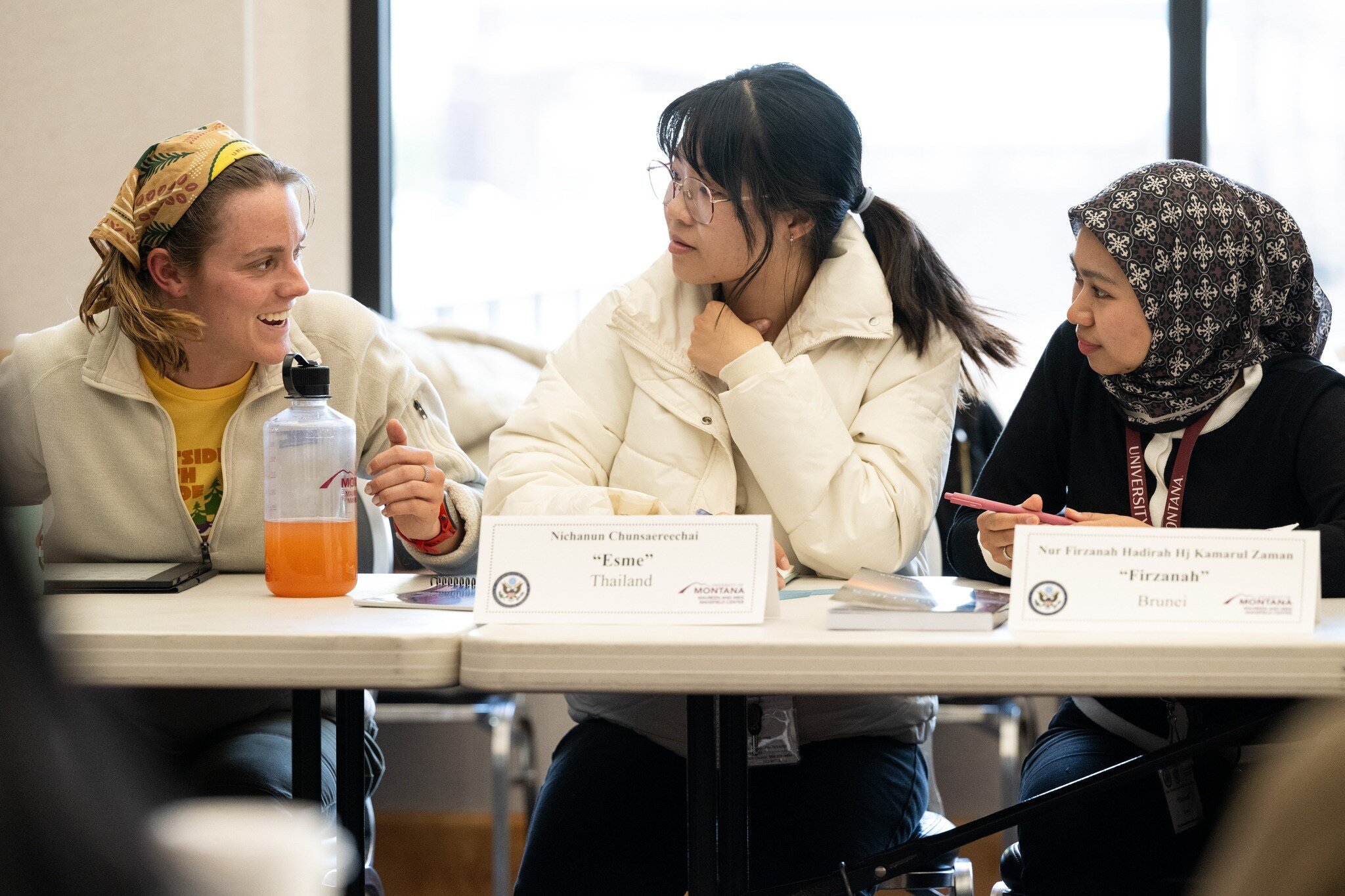 3 Fellows having a discussion with one another