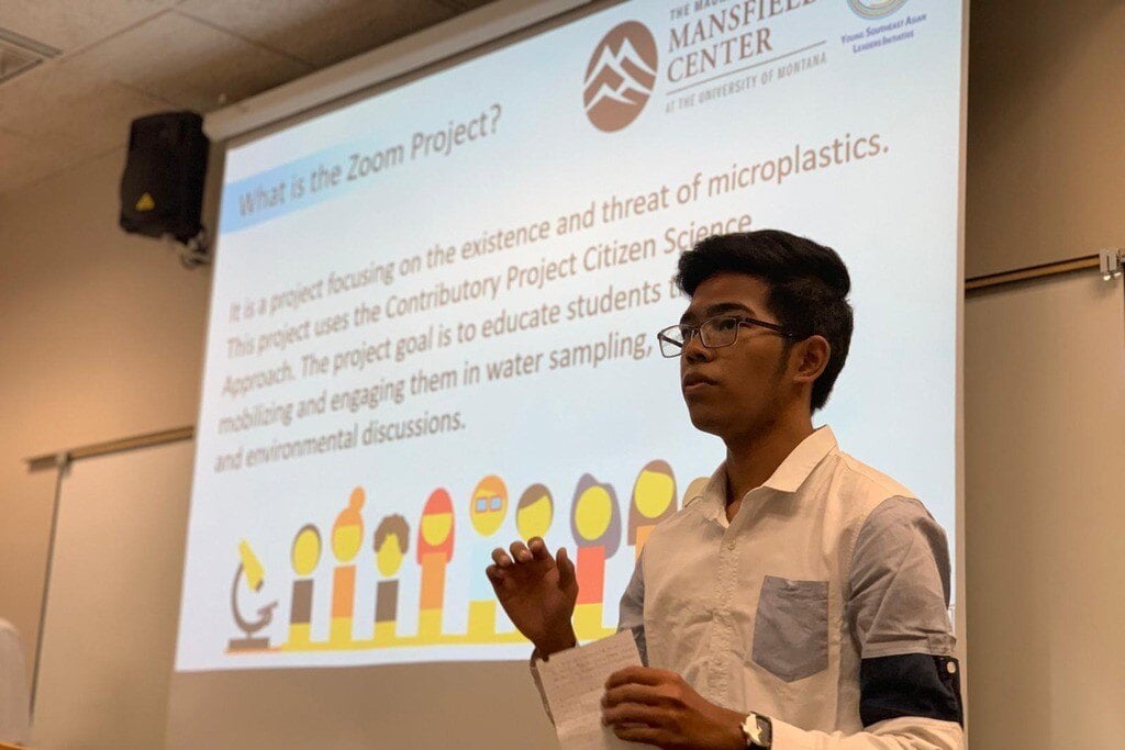 A man giving a presentation on what a Zoom Project is